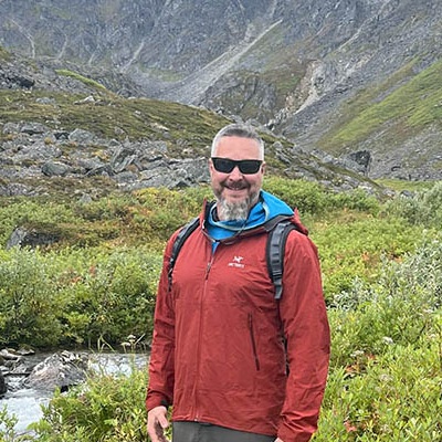 Brad Harris hiking in the mountains